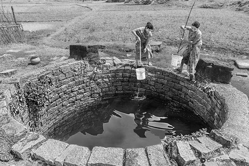 Forced to fetch drinking water from a distant traditional source in a ‘Har Ghar Jal’ village in Khunti district, Jharkhand, India